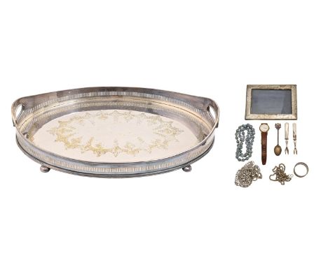 An EPNS oval galleried tray, on bun feet, 61cm w, a silver photograph frame, Birmingham 1912, a silver napkin ring, Walker &a