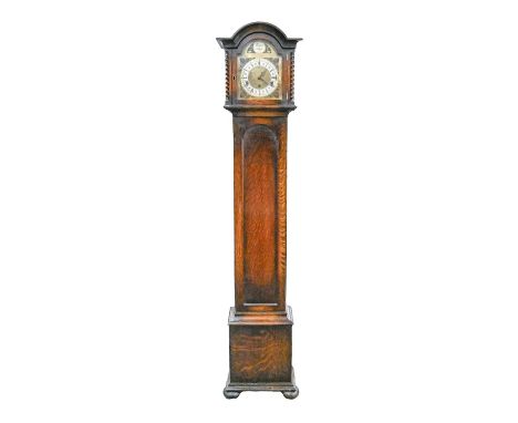 An oak dwarf longcase clock, c1930, with brass arch top dial, silver chapter ring inscribed Kemp Bros Union St Bristol, the h
