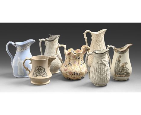 Seven earthenware and press moulded jugs, mid 19th c, to include an Argyle geometrically moulded jug with pewter lid and a T 
