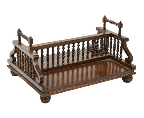 Mahogany table book stand, early 20th c, with turned balustrade and beadwork border, on reeded feet, 20cm h  Possibly some re