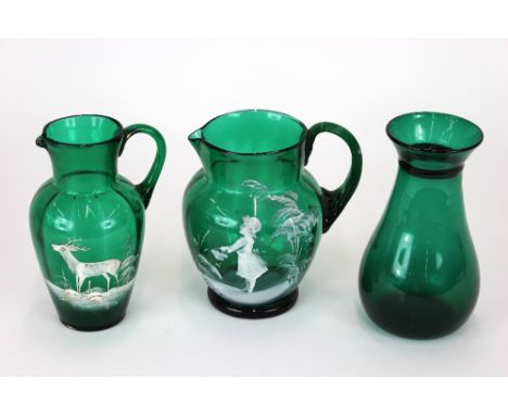 A green glass baluster shaped jug, Mary Gregory style enamel decoration of a girl with a flower basket in a garden, fluted ha