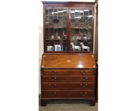 An Edwardian inlaid mahogany bureau bookcase, moulded cornice plain frieze, with two astragal glazed panel doors to the upper