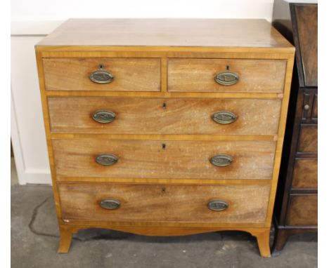 A George IV mahogany chest of drawers, the top with cross-banding and stringing, fitted with two short and three long drawers