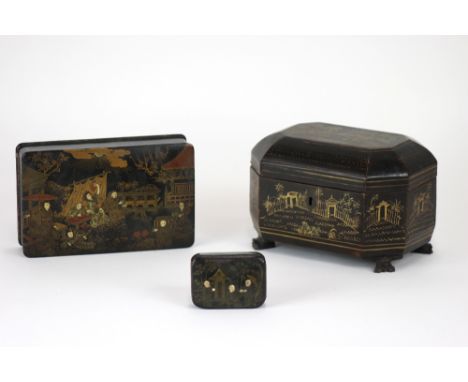 A Regency black lacquered chinoiserie decorated tea caddy, of oblong form with canted corners, painted with figures, a fenced