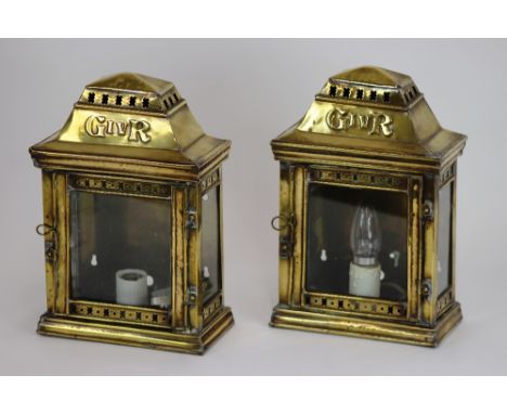 A pair of brass wall lanterns, bearing marks G IV R, 30cm; and a Dutch brass sconce, cartouche shape back with armorial, 50cm