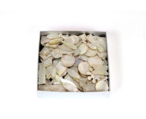 A collection of Cantonese mother of pearl gaming counters, mostly with engraved decoration
