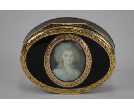 A yellow metal and tortoise shell oval box, indistinctly  marked, probably French, perhaps late 18th Century, bright cut engr