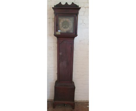 An oak longcase clock with brass face (weight and pendulum no ribbon)