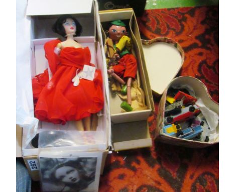 A Pelham Puppet, doll and some die cast cars