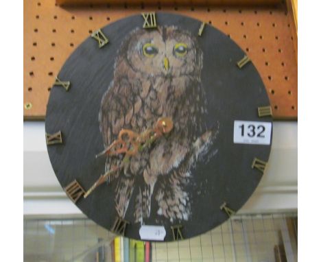 A slate wall clock with owl design by Gwilyn Williams