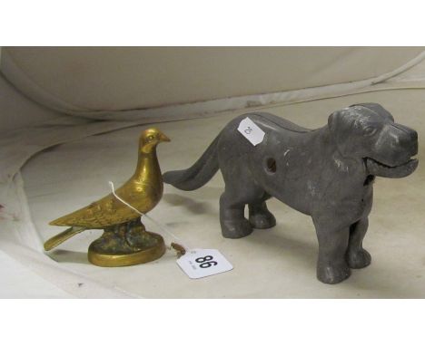 A dog nutcracker and a brass bird