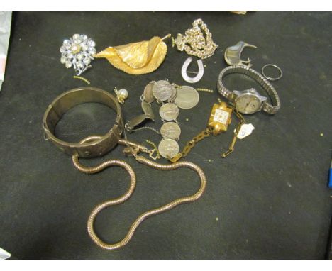 An enamel horse shoe, silver bangle and jewellery