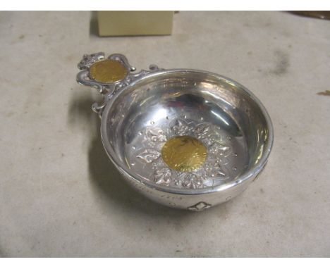 A wine taster with inset coins to base and handleimport silver marksmarks on piece part of design for 18th century style item