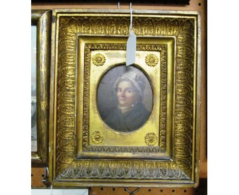 A 19th Century oil oval portrait of an elderly lady in a 19th Century gilt anthemion frame