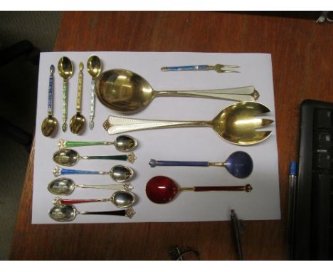 A pair of Norwegian silver coloured and enamel salad servers marked sterling and a group of spoons