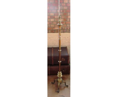 A brass floor lamp