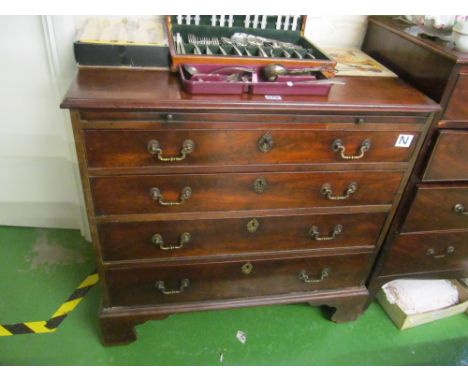 A 19th Century mahogany chest with slide and four drawers on bracket feet