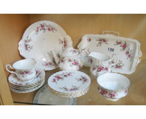 A Royal Albert Lavender Rose part teaset; bread and butter plate, sandwich plate, teapot (missing finial), milk jug, sugar bo