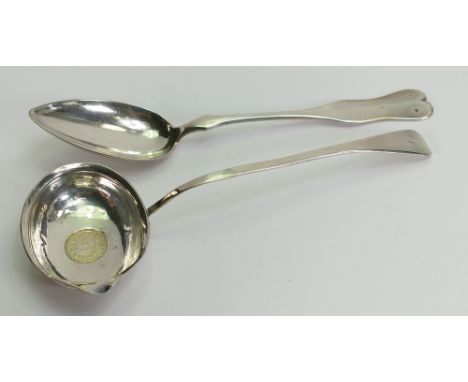 George III silver ladle & continental serving spoon: Gross weight 128.6g. Ladle with middle Eastern coin set in base.        