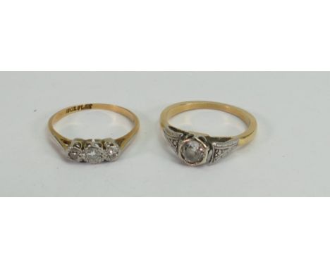 Two diamond rings: A 3 stone and a single stone ring, both set in yellow coloured metal, tested as high carat gold. Gross wei