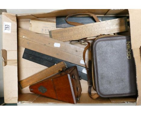 A mixed collection of items to include Mahogany metronome : slide rulers, geometry  rulers, and 8mm cini camera