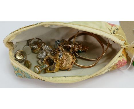 A pouch containing ladies vintage costume jewellery: including frog and owl brooches, earrings, bracelets etc