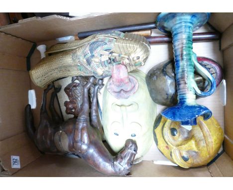 A mixed collection of items to include damaged Egyptian theme figure: leather model of horse, ethnic masks, welsh type candle