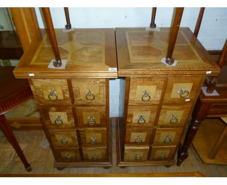 A pair of good quality Flagstone narrow chests, each with intricate inlaid stone tops above eight drawers with drop ring hand