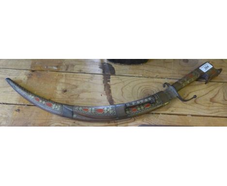 A decorative brass inlaid Eastern dagger 