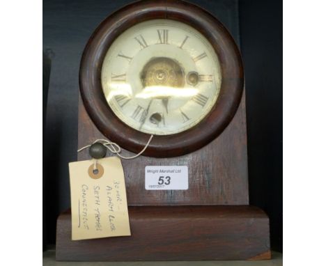 A 20th Century American alarm clock by Seth Thomas Connecticut, in a rosewood case 