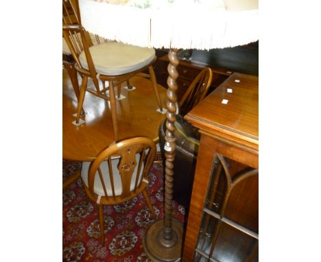 A 1920/30's oak barley twist standard lamp, with vintage floral chintz shade (sold electrically untested).