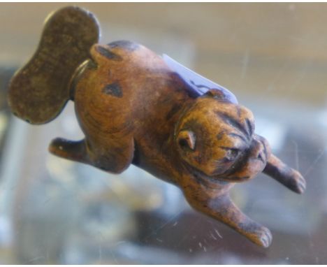 A antique? Treen pipe model in a form of a dog together with a Terry's hedgehog pipe Reamer 