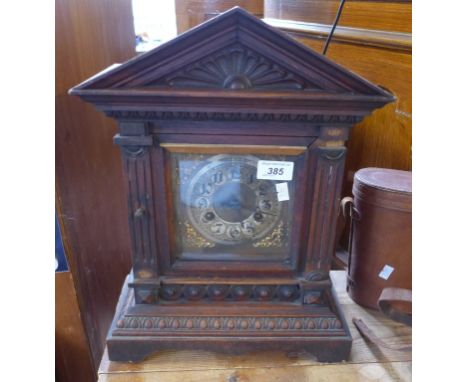 An early 20th century medium oak mantle clock 