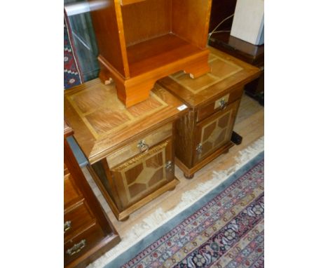 A pair of good quality and highly decorative Flagstone bedside cabinets, each having inlaid top above frieze drawer and elabo