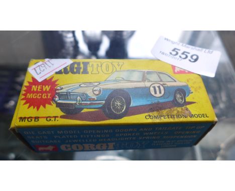 A boxed Corgi model of a MGB GT competition model car 