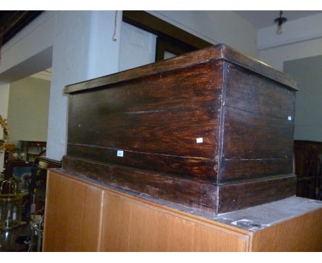 A reproduction Victorian-style stained hardwood trunk.