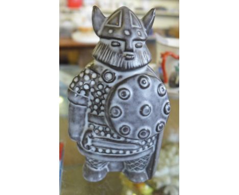 An unusual Upsala-Ekeby pottery model of a Swedish Viking designed by Taisto Kaasinen, signed to base.