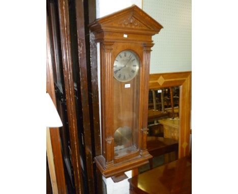 A 19th Century glazed oak cased Vienna type wall clock of architectural form, the circular dial inscribed 'Gaydon & Sons, Clo