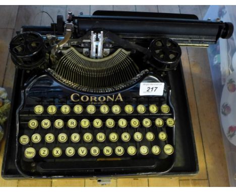 A Corona portable typewriter circa 1926, fitted in case