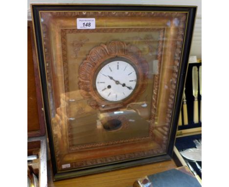A 19th Century possible French picture clock inset in gilt frame and white enamel dial 