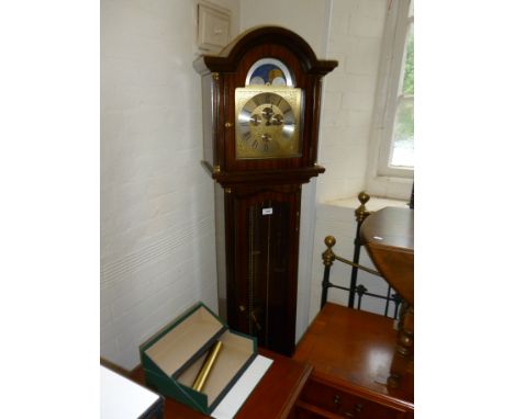 A reproduction Georgian style German made striking longcase clock, the arched dial with moving moon phase movement complete w