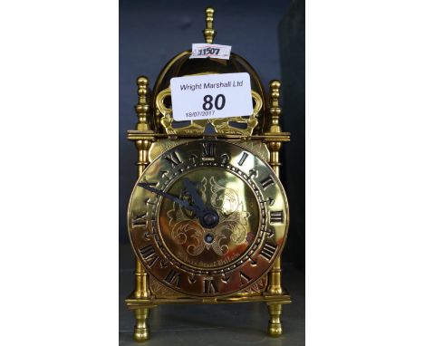 A Smiths brass bound rectangular carriage clock with architectural domed top   CONDITION REPORT:  No key to wind clock up