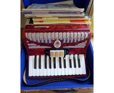 A vintage cased piano accordion by Sorrento   