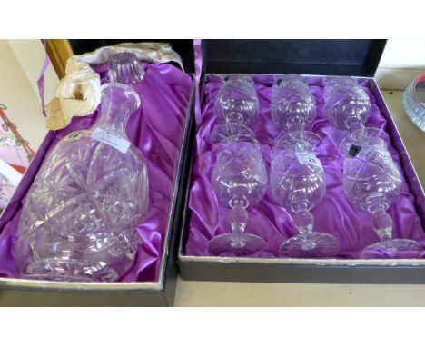 An Edinburgh international crystal decanter and six glasses, each contained in original boxes 