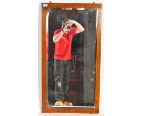 A retro vintage mid 20th century teak over mantel mirror of rectangular form having a show wood frame.&nbsp;measures approx: 