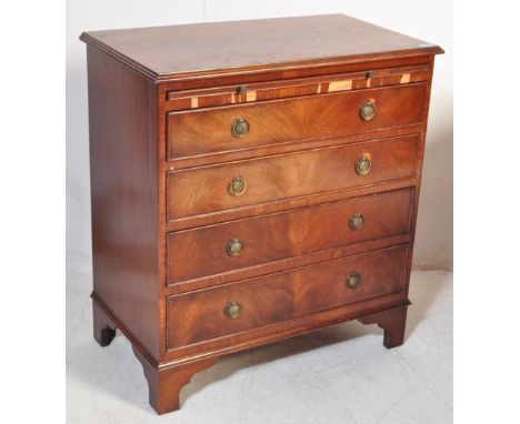 An 18th century reproduction walnut veneer bachelor’s chest of drawers. Raised on bracket feet with a bank of 4 drawers havin