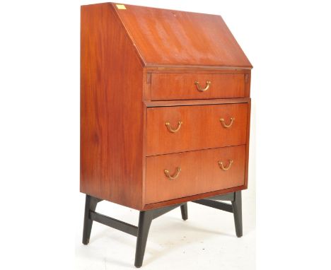 A retro vintage mid 20th century teak wood bureau having a fall front writing area opening to reveal a fully appointed interi