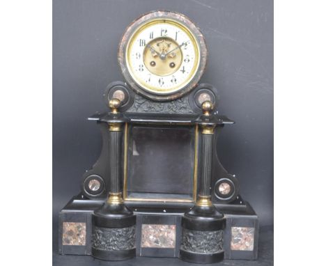 A 19th century Victorian Neoclassical slate mantle clock of architectural form. The mantel clock having clock face to the top
