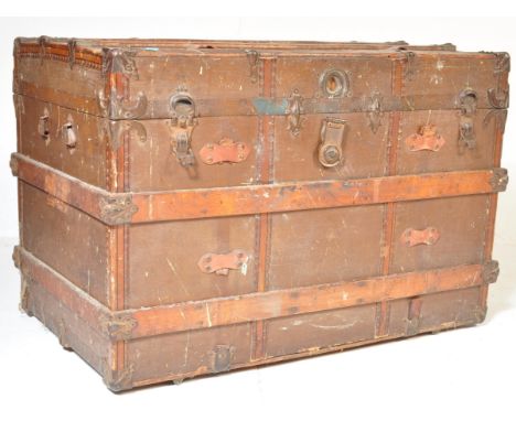A 19th century Victorian canvas and wooden bound steamer trunk. The trunk being of large oversized form, rectangular construc