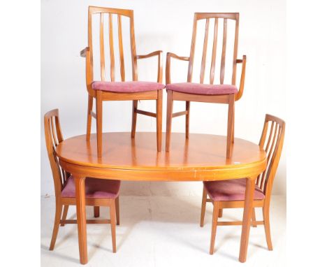 A retro vintage mid 20th century teak wood Nathan extendable dining table and chairs. The table is of oval form having a sing